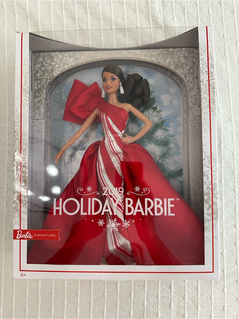 Barbie 2019 Holiday Doll in Red and White Striped One-Shoulder Gown with Bow